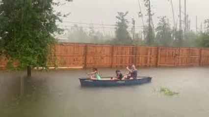 Family Turns Flooded Backyard into Canoe Fun