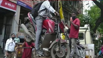 Man hanging with bike from towing crane in Pune, video viral