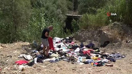 Manavgat'ta yardım için toplanan kıyafetleri dere kenarına attılar