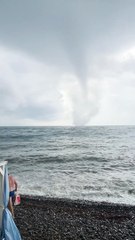 Beautiful Tornado Comes From the Ocean and Crashes into Shoreline