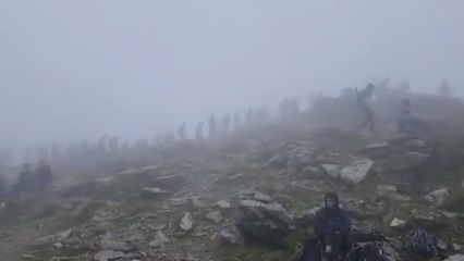 Footage shows huge queues of climbers waiting to get to top of Snowdon