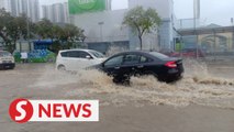 Heavy rain submerges parts of Bayan Baru, traffic comes to a crawl as water level rises
