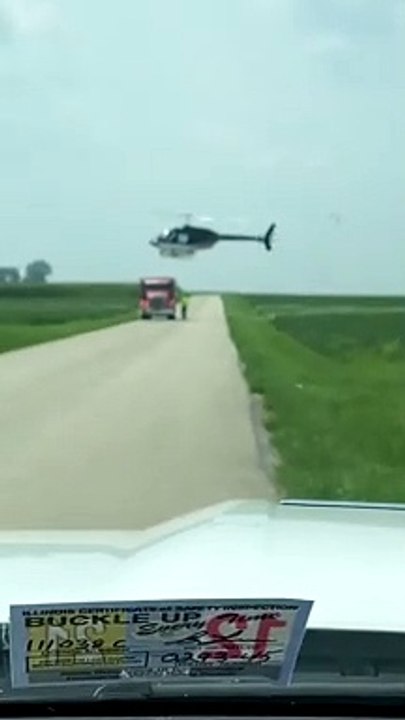 Helicopter Lands on Semi