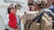 US Soldiers caring children-women at Kabul airport
