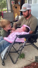 Big Brother Settles Newborn Sister With a Song