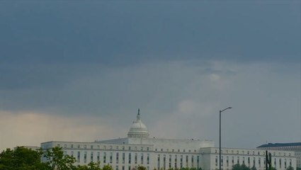 Dark storm clouds drift over the US Capitol