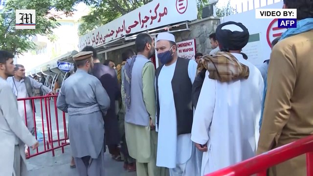 Kabul airport blasts: Grieving relatives collect bodies from hospital