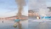 İtfaiyeciler, teknedeki yangını söndürmek için kıyafetleri ile denize girdi