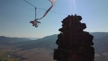 Woman Displays Impressive Aerial Acrobatic Skills While Performing At High Altitude Amongst Mountain