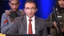 Watch: Armed Taliban fighters surround Afghan TV anchor during a programme