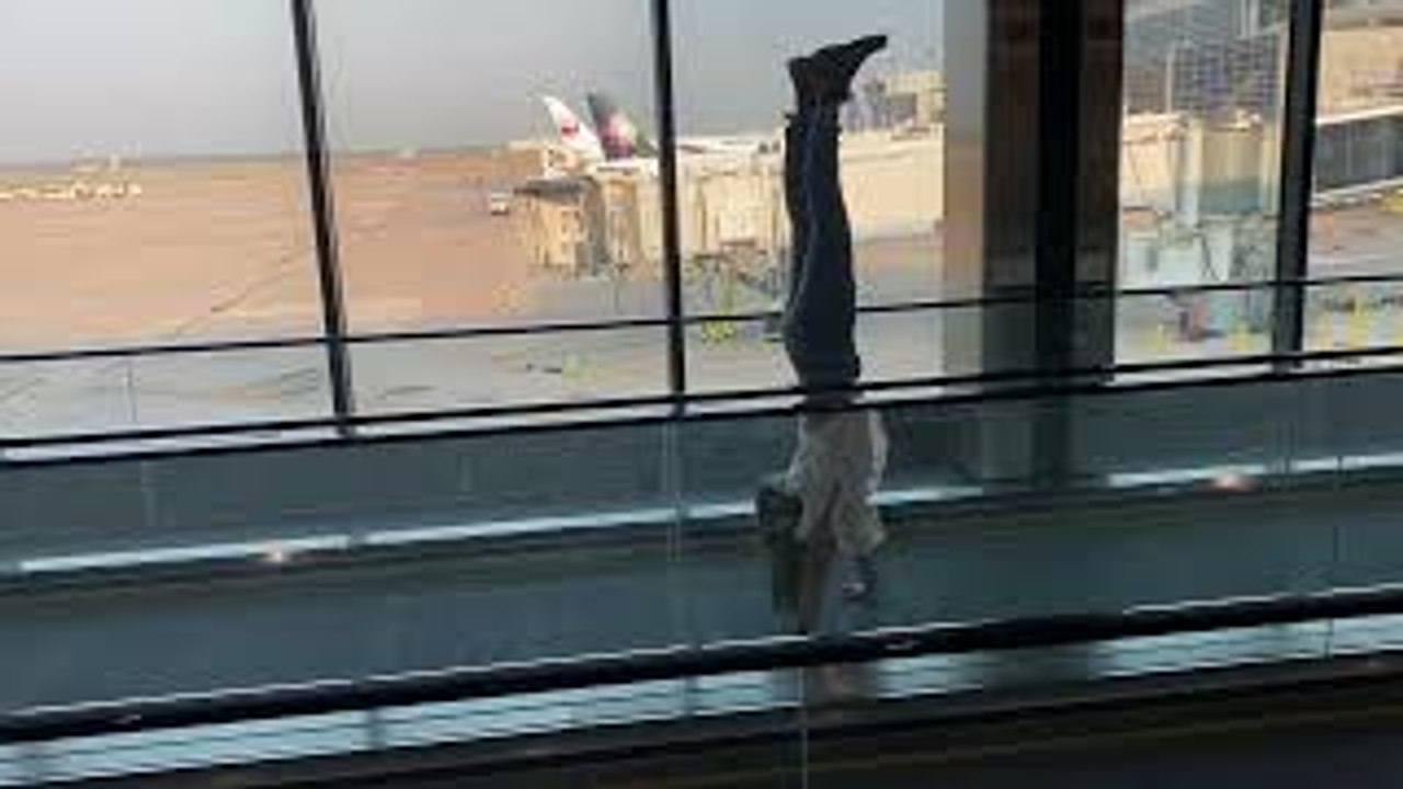 Handstands Down Moving Sidewalks