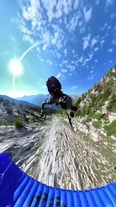 Paraglider Flies and Flips Over Rocks