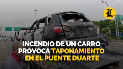 Incendio de un carro provoca taponamiento en el puente Duarte