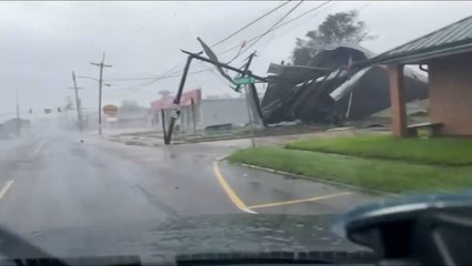 Dash cam captures Ida's winds ripping roof off building