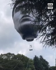 Giant Head Floats Over Tokyo Park