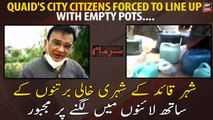Quaid's City  citizens forced to line up with empty pots....