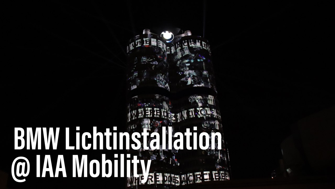 Iaa mobility 2021: lichtinszenierung projiziert wegweisende botschaften auf die bmw zentrale