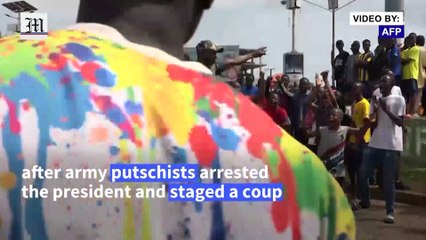 Guinean opposition activists rejoice after army seizes power