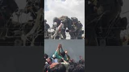 Afghan Infant Passed to Soldiers at Airport