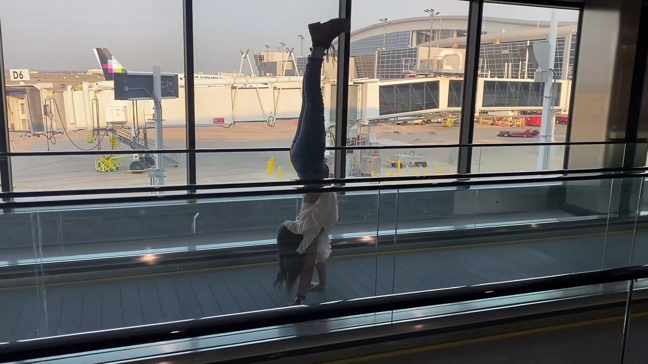 Handstands Down Moving Sidewalks