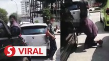 Two men detained after being caught on video stealing vehicle components