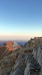 Hiker and Mountain Goats Meet on Bridger Range Summit