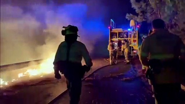 Spanish firefighters battle to contain wildfires in Andalusia