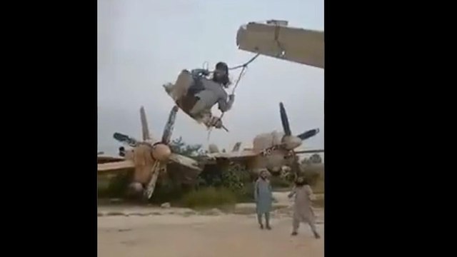 Taliban fighters swinging from wing of US plane, Video Viral