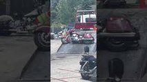 Tow Truck Drags Motorcycle Up Ramp