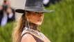 Jennifer Lopez Wore a Cowboy Hat With a Low-Cut, Thigh-Slit Gown at the Met Gala