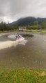 Man Effortlessly Rides Jet Ski On Flooded Yard Outside House After Heavy Rainfall