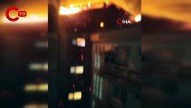 Karşı apartmandaki yangına balkondan hortumla müdahale etti