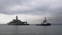 Royal Navy 'ghost ship' HMS Monmouth returns to Portsmouth to face an uncertain future