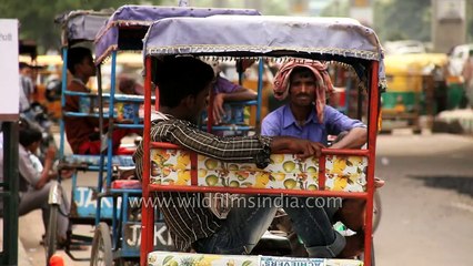 People enter and exit at the MG road Metro Station