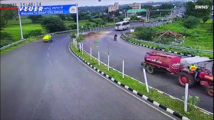 Motorcyclist Hit by a Bus, Miraculously Emerges Unharmed From Beneath Its Wheels