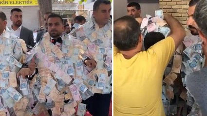 Aşiret düğününde damada takılan parayı 4 kişi zor taşıdı