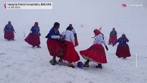 Bolivian Cholitas play football at top of a mountain