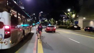 AROUND 10 CYCLIST GATHERS IN MIDDLE OF ROAD NEAR SUNTEC