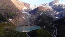 Aerial View Of Mountains With Snow