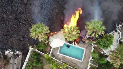 Moment lava pours into swimming pool on Spain's La Palma