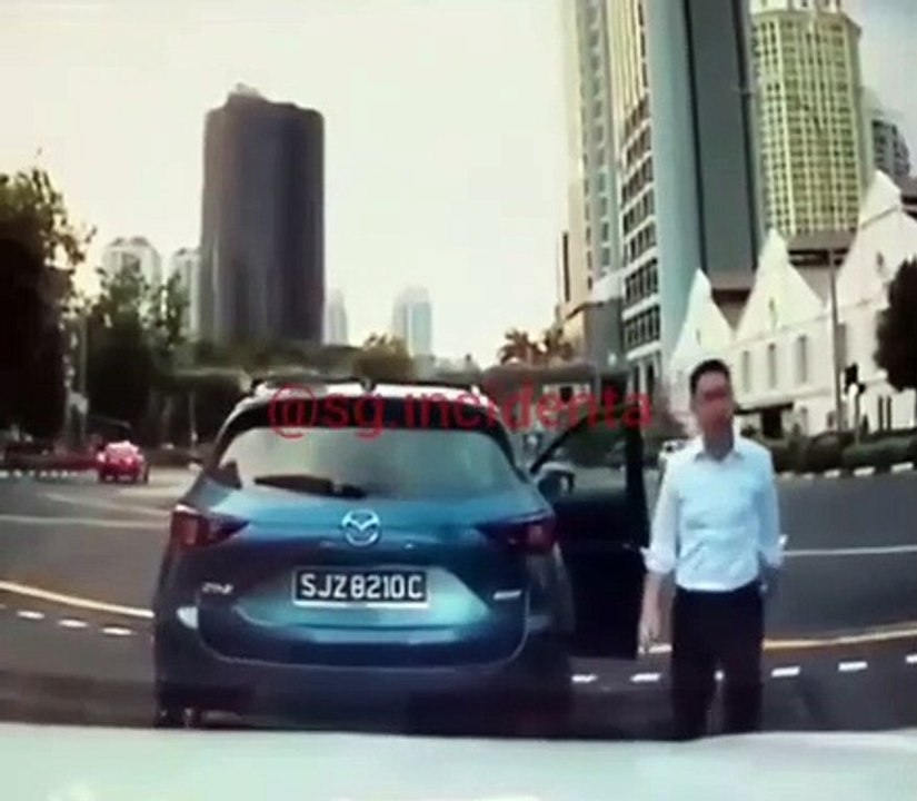 Man walks out of car all ready to road rage but car rolls away and he runs after it like a cockster