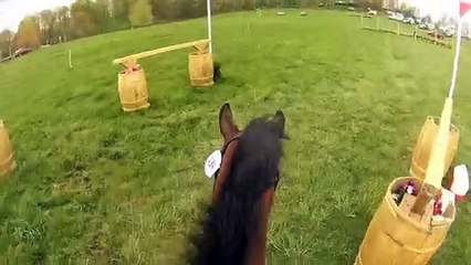 Girl Wearing Helmet Cam Encourages Horse During Competition