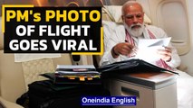 PM Modi tweets picture of flight to US, gets praised for commitment to work | Oneindia News