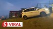 A “flying” Perodua Myvi lands safely on a slope in KL