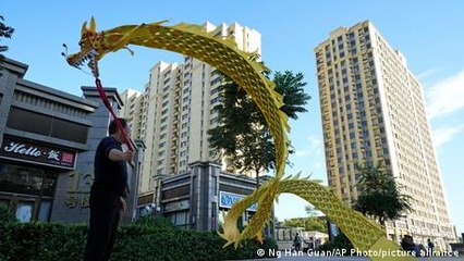 China's Evergrande calms default fears with $36 million debt deal