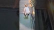 Toddler Attempts to Cross onto Glass Bridge