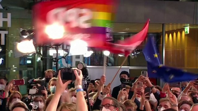 SPD leader Olaf Scholz celebrates with supporters after coming first in German election as attention turns to coalition building