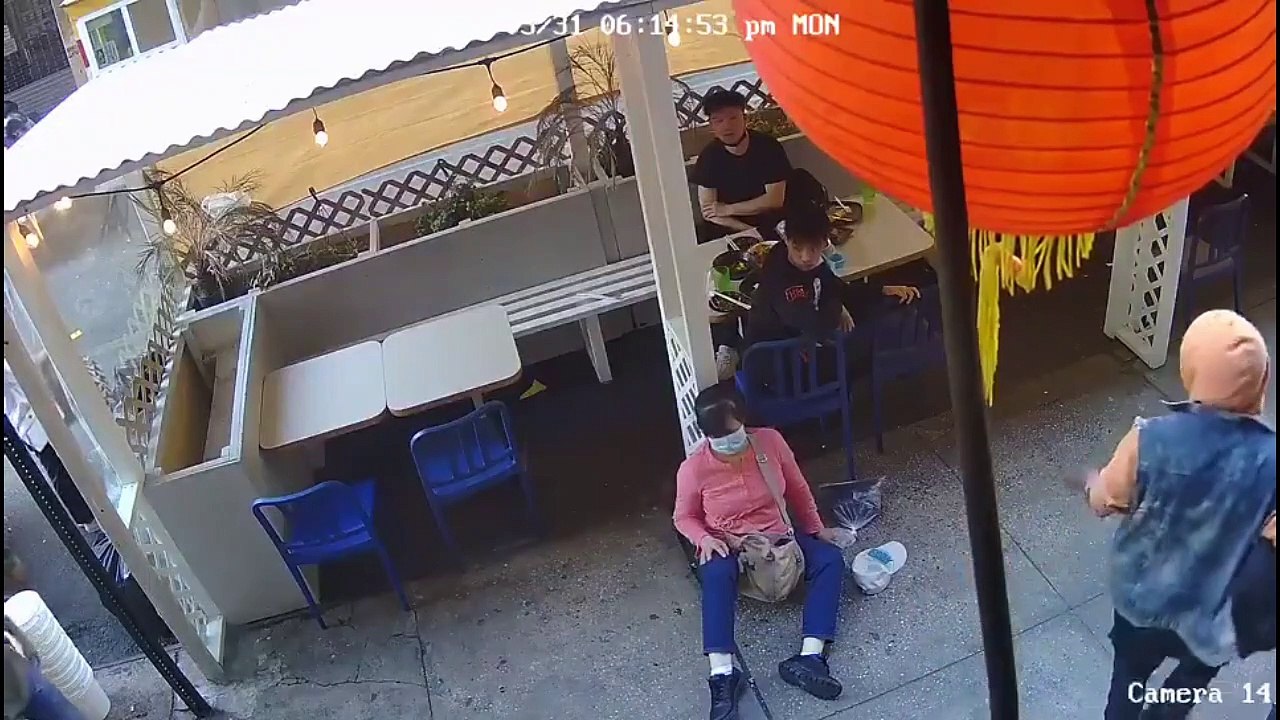 Black man randomly sucker punches an asian woman on the sidewalk knocking her out in broad daylight in front of pedestrians