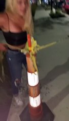 Woman Falls Into Weeds Trying to Pick Up Safety Cone