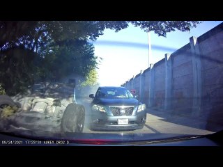 Upside-Down Car Slides Down Roadway
